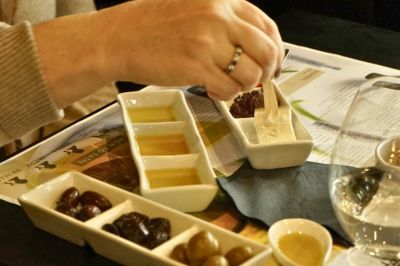 Greek olive oil tasting with bread, olives and food pairings in Athens.