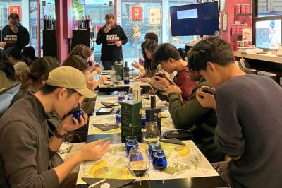 Group olive oil tasting in Athens with guests tasting Greek extra virgin olive oil.